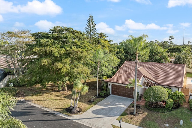 view of front of house featuring a front yard and a garage