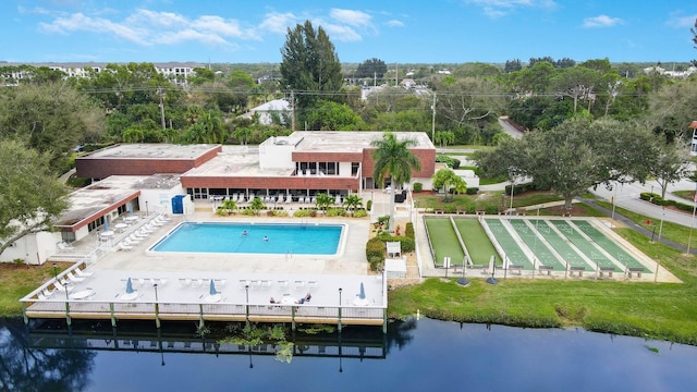 back of property with a water view