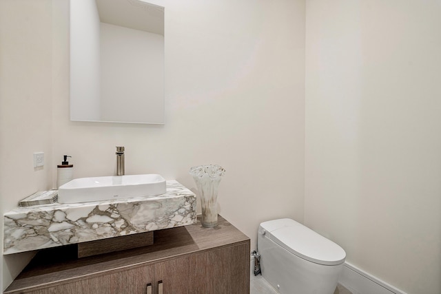 bathroom featuring sink and toilet