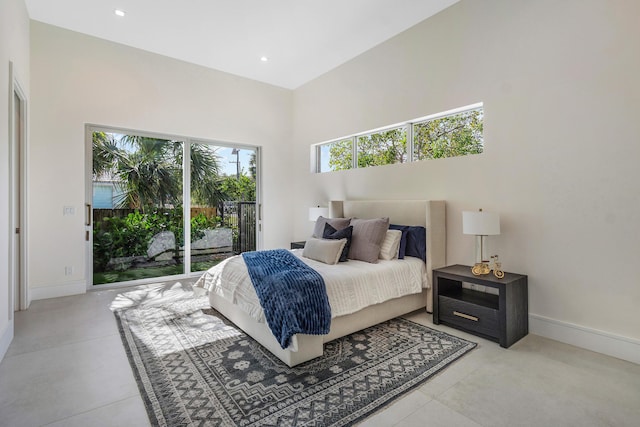 bedroom with access to outside and multiple windows