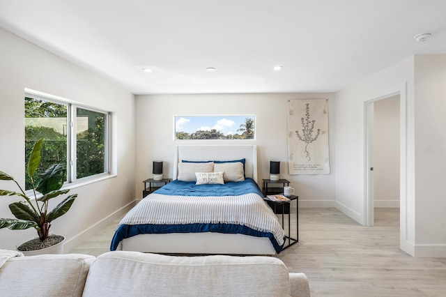 bedroom with light hardwood / wood-style flooring