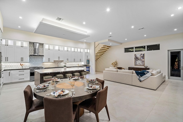 dining space featuring light tile patterned flooring