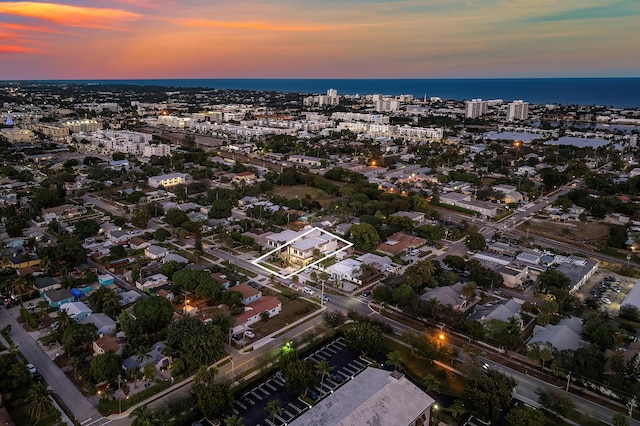 aerial view at dusk with a water view