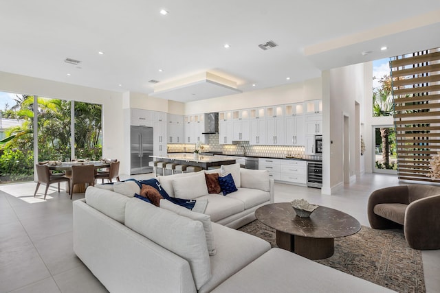 living room with wine cooler and a wealth of natural light