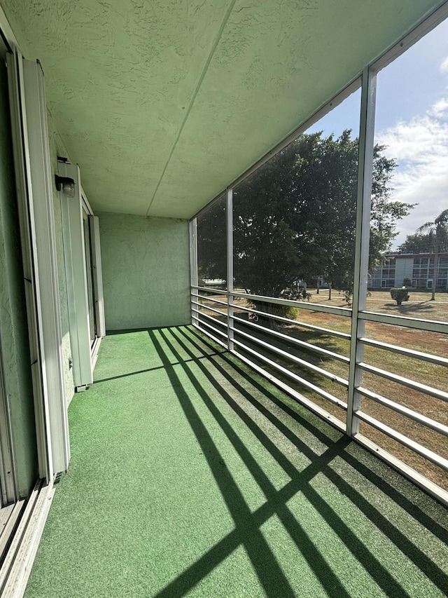 view of yard with a balcony