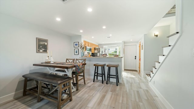 dining room with light hardwood / wood-style floors