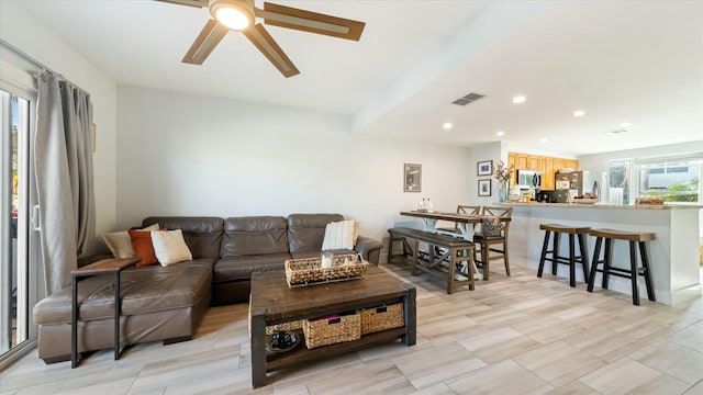 living room featuring ceiling fan