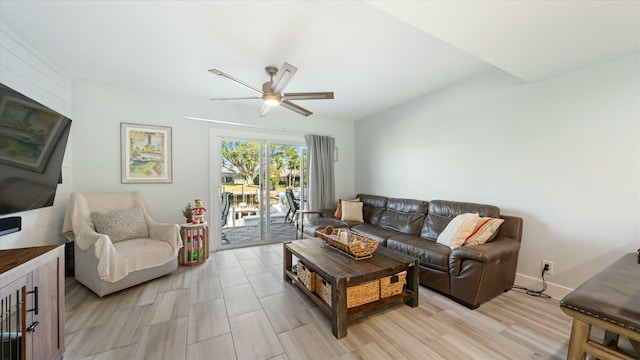 living room with ceiling fan and light hardwood / wood-style flooring