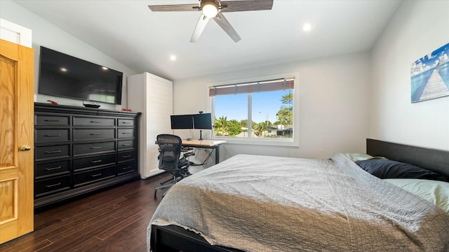 bedroom with dark hardwood / wood-style floors, ceiling fan, and lofted ceiling