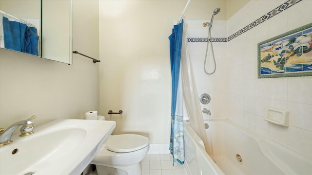 full bathroom featuring tile patterned flooring, toilet, shower / bathtub combination with curtain, and sink