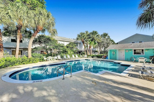 view of swimming pool with a patio area