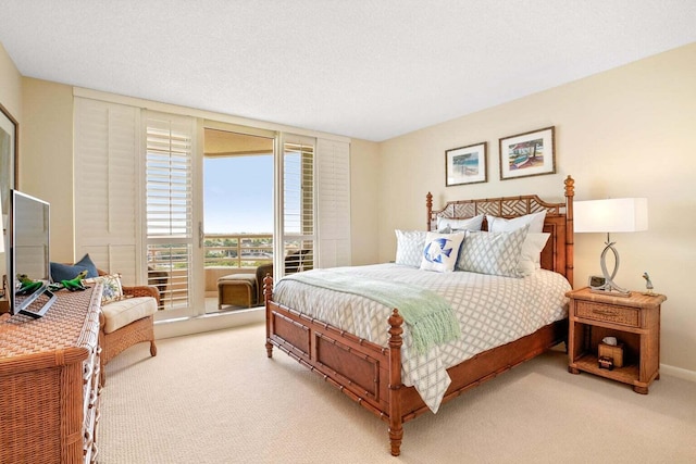 carpeted bedroom featuring a textured ceiling