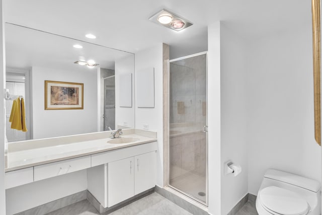 bathroom with vanity, toilet, and walk in shower