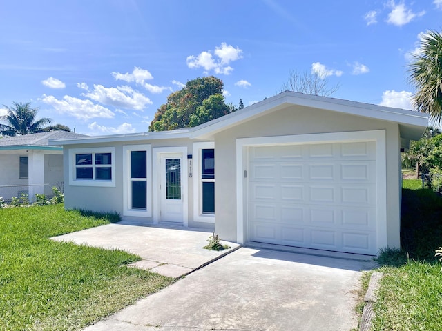 ranch-style house with a garage, driveway, a front lawn, and stucco siding