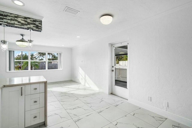 interior space with crown molding