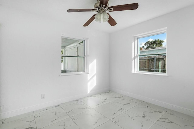 spare room with ceiling fan