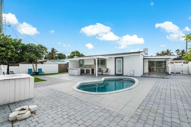 view of swimming pool with a patio area