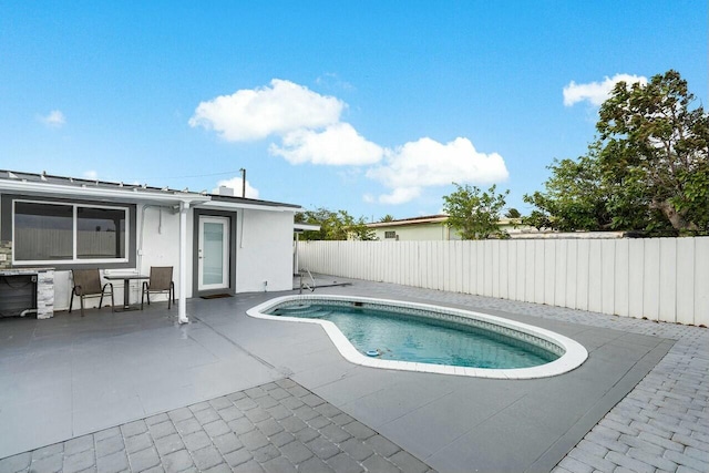 view of pool with a patio