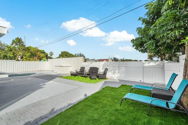 view of yard featuring a patio area and a pool