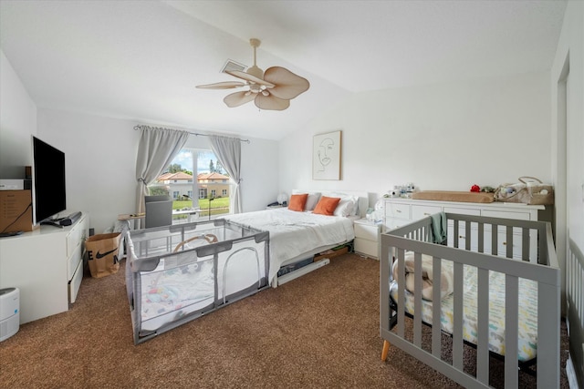 carpeted bedroom with vaulted ceiling and ceiling fan