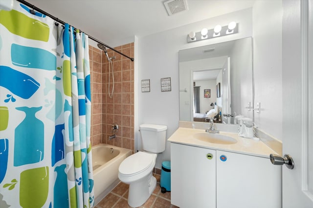 full bathroom with tile patterned flooring, vanity, toilet, and shower / bath combo with shower curtain