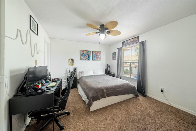 bedroom with carpet flooring, ceiling fan, and a textured ceiling