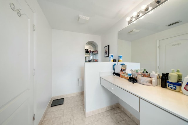 bathroom with tile patterned floors