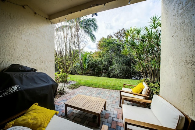 view of patio featuring a grill