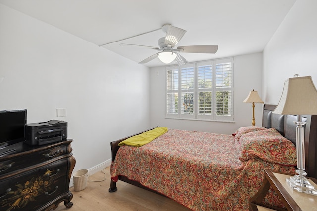 bedroom with ceiling fan and light hardwood / wood-style floors