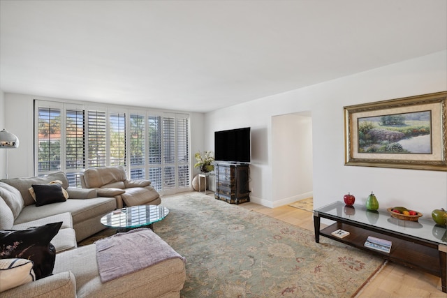 living room with light hardwood / wood-style flooring