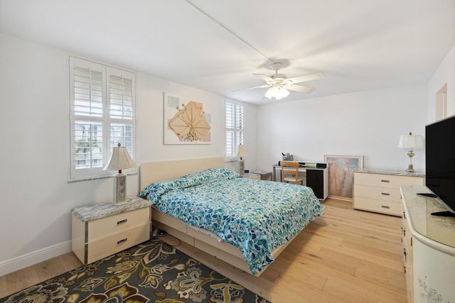 bedroom featuring ceiling fan and light hardwood / wood-style flooring