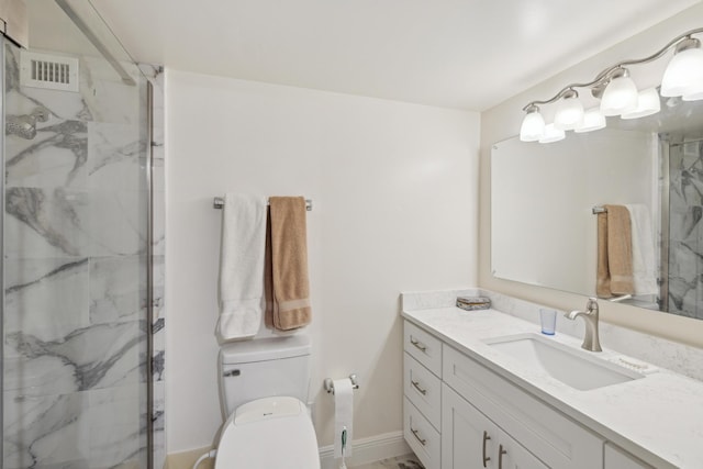 bathroom featuring vanity, toilet, and walk in shower