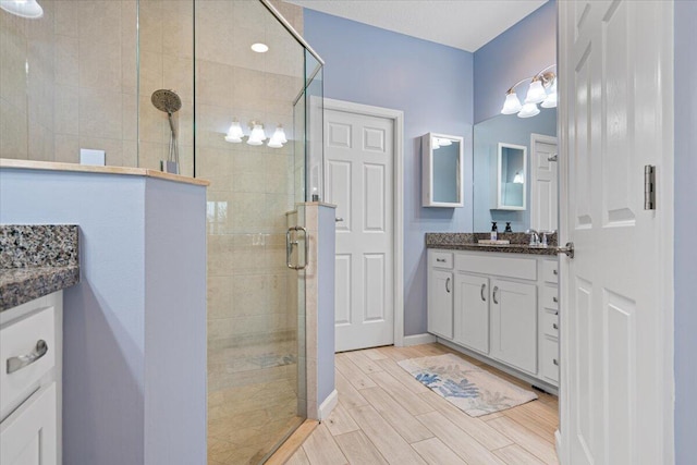 bathroom with vanity and walk in shower