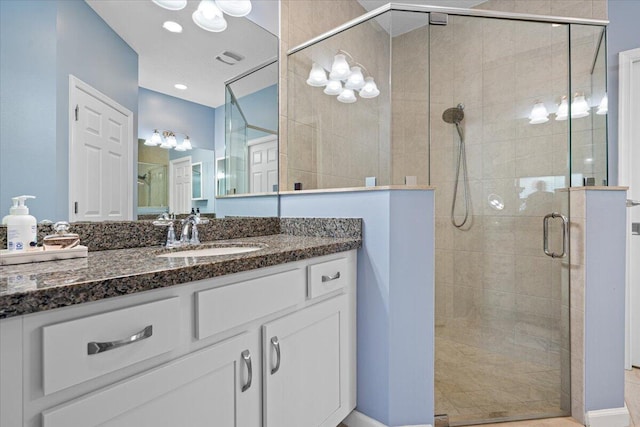 bathroom featuring vanity and walk in shower