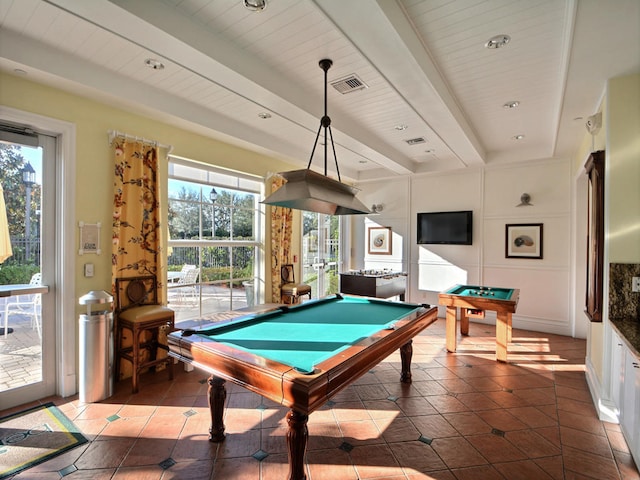 recreation room with beam ceiling, a healthy amount of sunlight, dark tile patterned flooring, and billiards