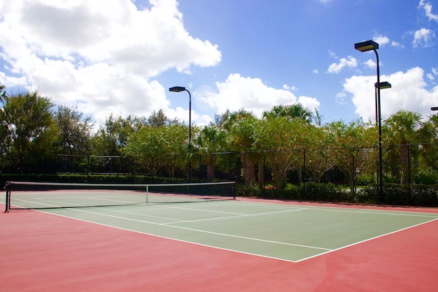 view of tennis court featuring basketball court