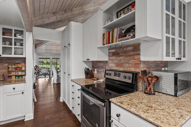 kitchen featuring light stone counters, white cabinets, stainless steel appliances, and dark hardwood / wood-style floors