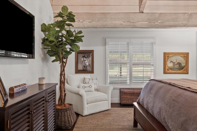 bedroom with hardwood / wood-style flooring and beam ceiling