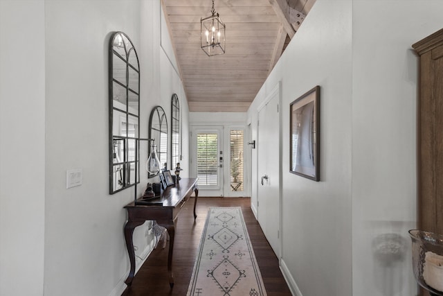 hallway featuring dark hardwood / wood-style flooring, high vaulted ceiling, wooden ceiling, and a notable chandelier