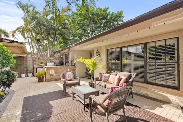 view of patio / terrace with area for grilling and an outdoor hangout area