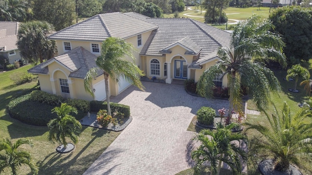 view of front of home with french doors and a garage