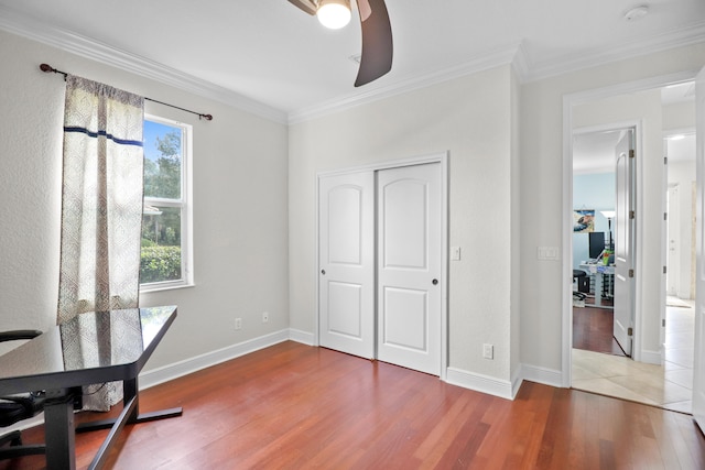 office space featuring hardwood / wood-style floors, ceiling fan, and ornamental molding