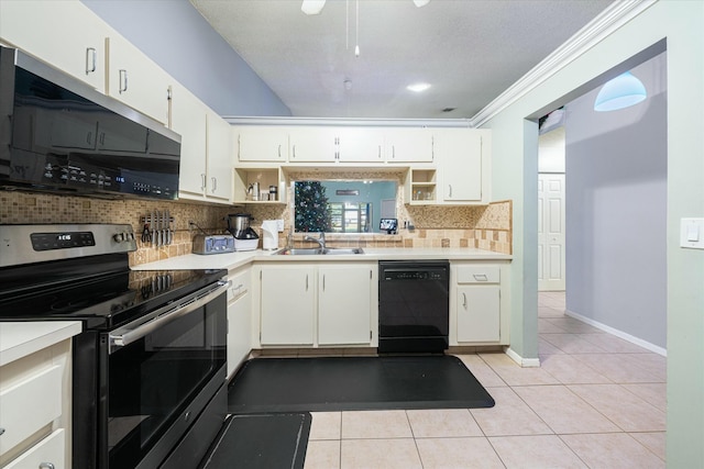 kitchen featuring stainless steel range with electric stovetop, crown molding, sink, white cabinets, and black dishwasher