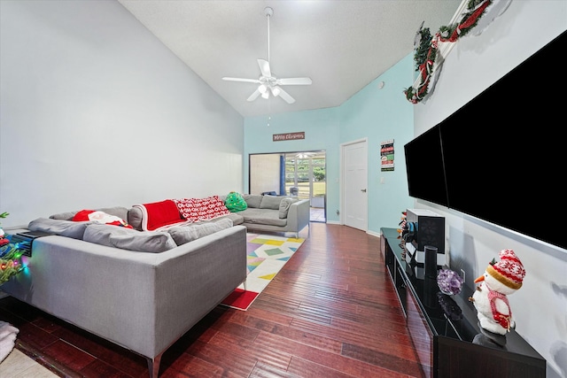 living room with ceiling fan, dark hardwood / wood-style flooring, and high vaulted ceiling