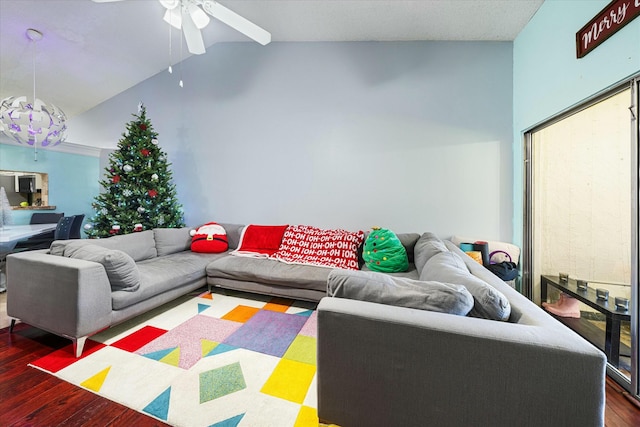 living room with ceiling fan, dark hardwood / wood-style flooring, and high vaulted ceiling