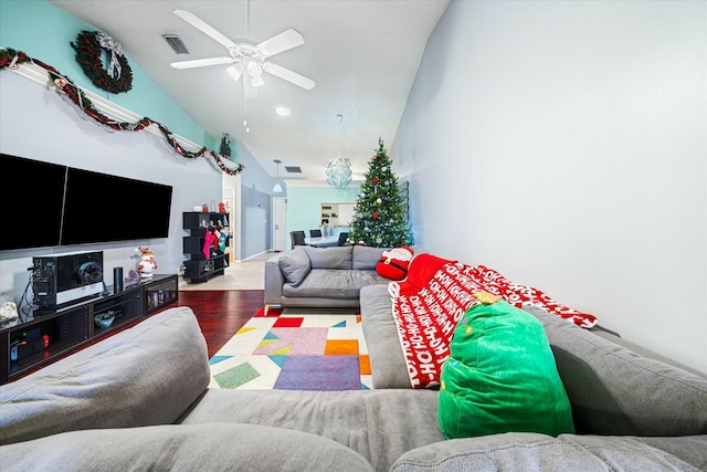 living room featuring wood-type flooring, vaulted ceiling, and ceiling fan