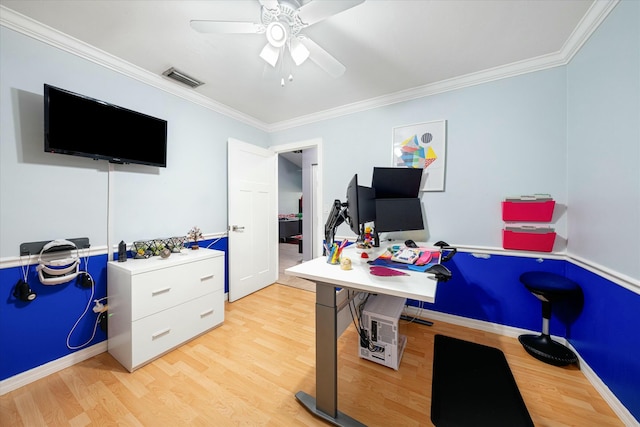 home office with light wood-type flooring, ceiling fan, and crown molding