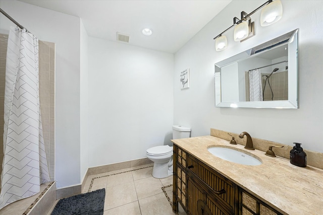 bathroom featuring tile patterned floors, curtained shower, vanity, and toilet