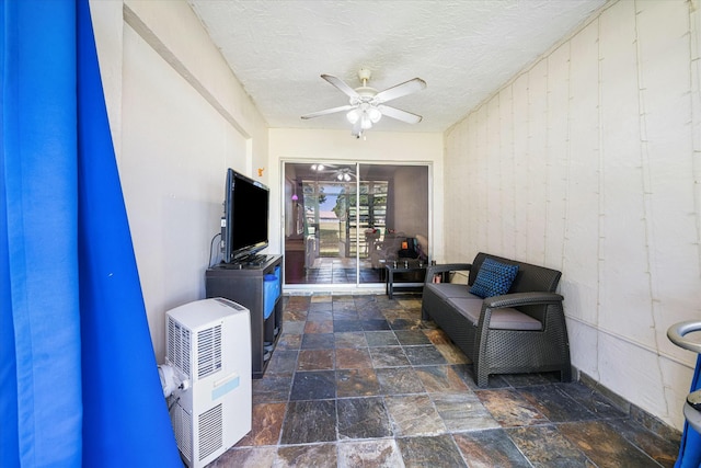 interior space featuring ceiling fan