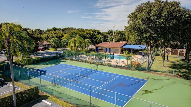 view of tennis court featuring basketball court